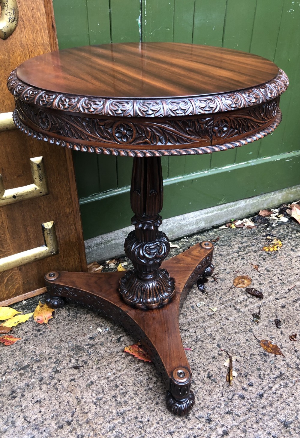 Mid C19th Anglo-Indian heavily-carved rosewood circular pedestal table.