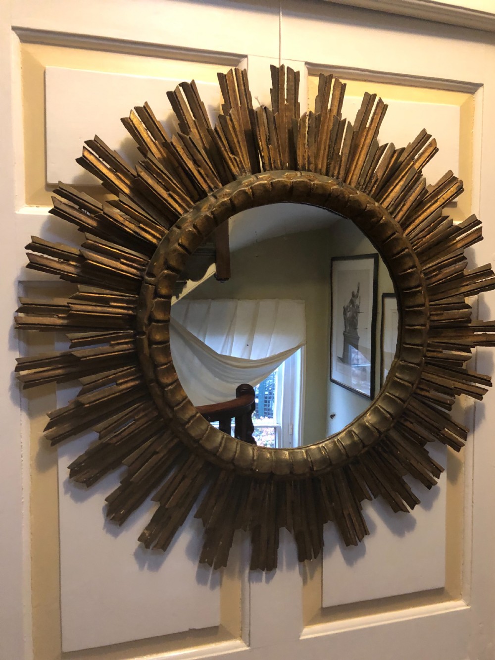 Highly decorative early C20th carved gilt-wood “sunburst” frame circular mirror . View II
