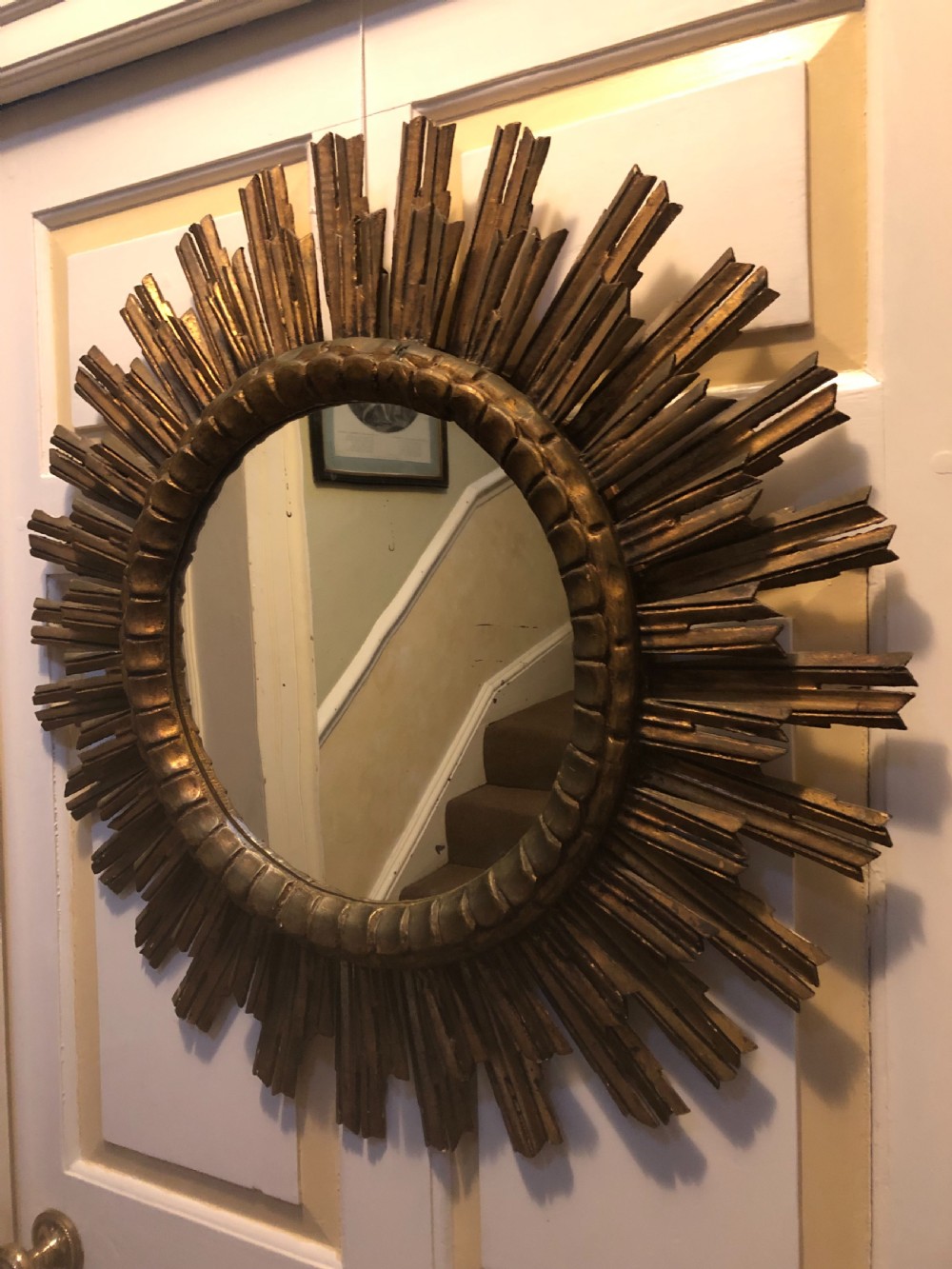 Highly decorative early C20th carved gilt-wood “sunburst” frame circular mirror . View V