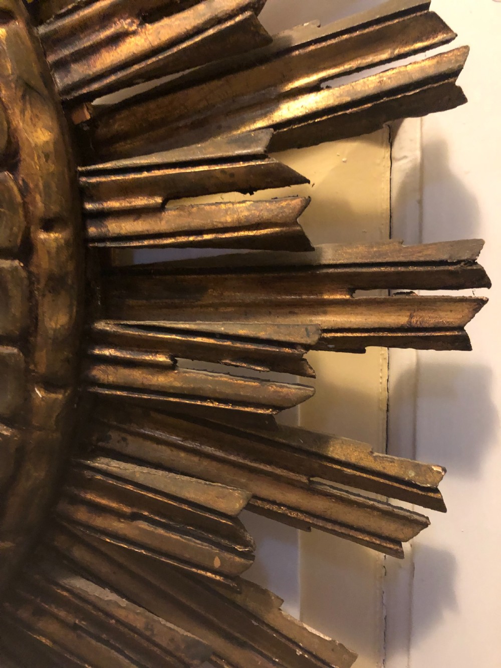Highly decorative early C20th carved gilt-wood “sunburst” frame circular mirror . View VI