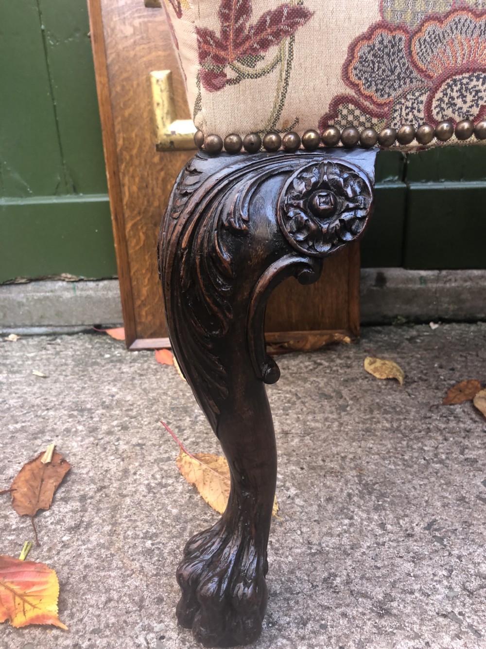 A rectangular floral upholstered stool featuring dark carved walnut cabriole legs with floral knees and claw-and-ball feet. View IX