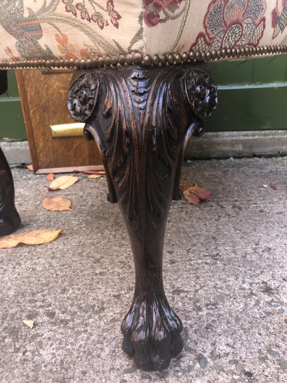 A rectangular floral upholstered stool featuring dark carved walnut cabriole legs with floral knees and claw-and-ball feet. View XI