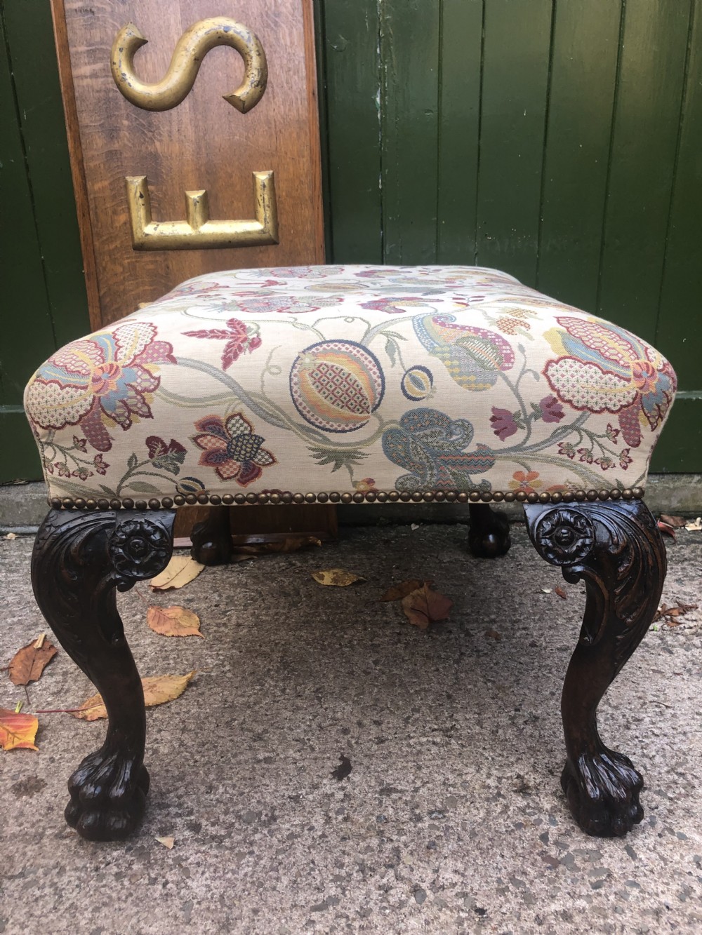 A rectangular floral upholstered stool featuring dark carved walnut cabriole legs with floral knees and claw-and-ball feet. View XIV
