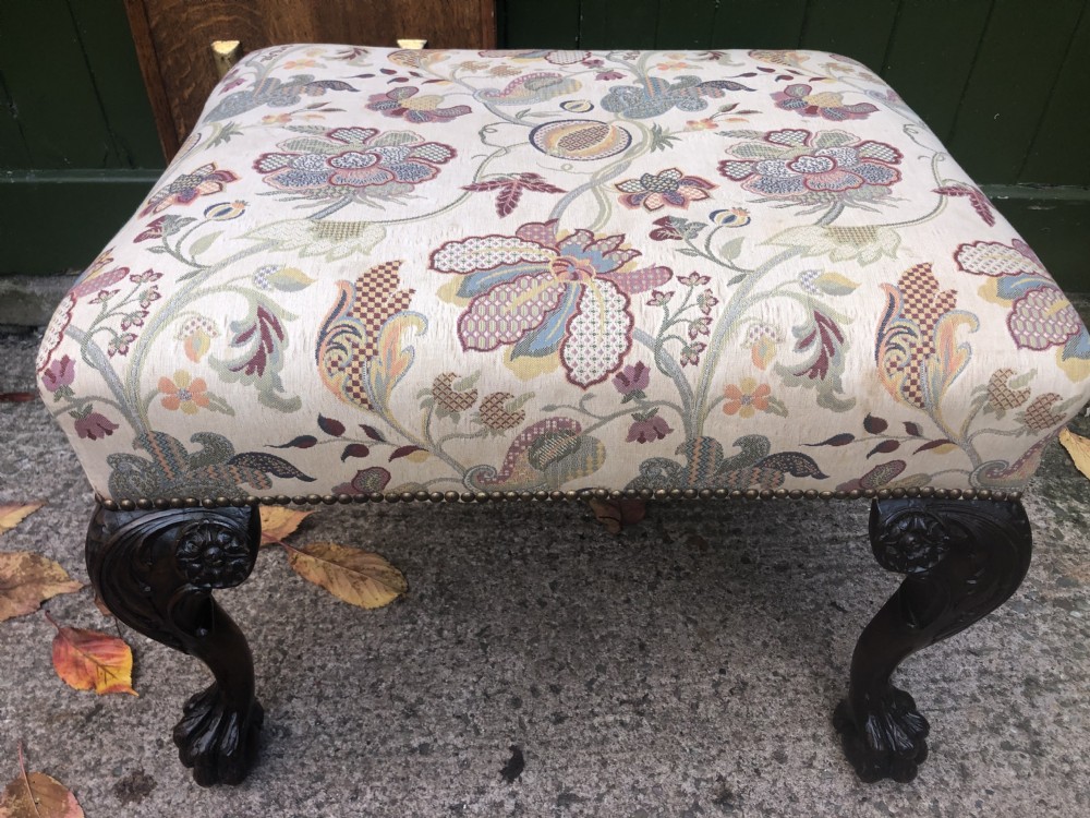 A rectangular floral upholstered stool featuring dark carved walnut cabriole legs with floral knees and claw-and-ball feet. View XVI