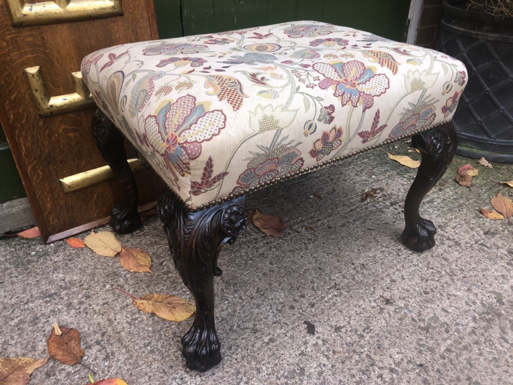 A rectangular floral upholstered stool featuring dark carved walnut cabriole legs with floral knees and claw-and-ball feet. View XVII