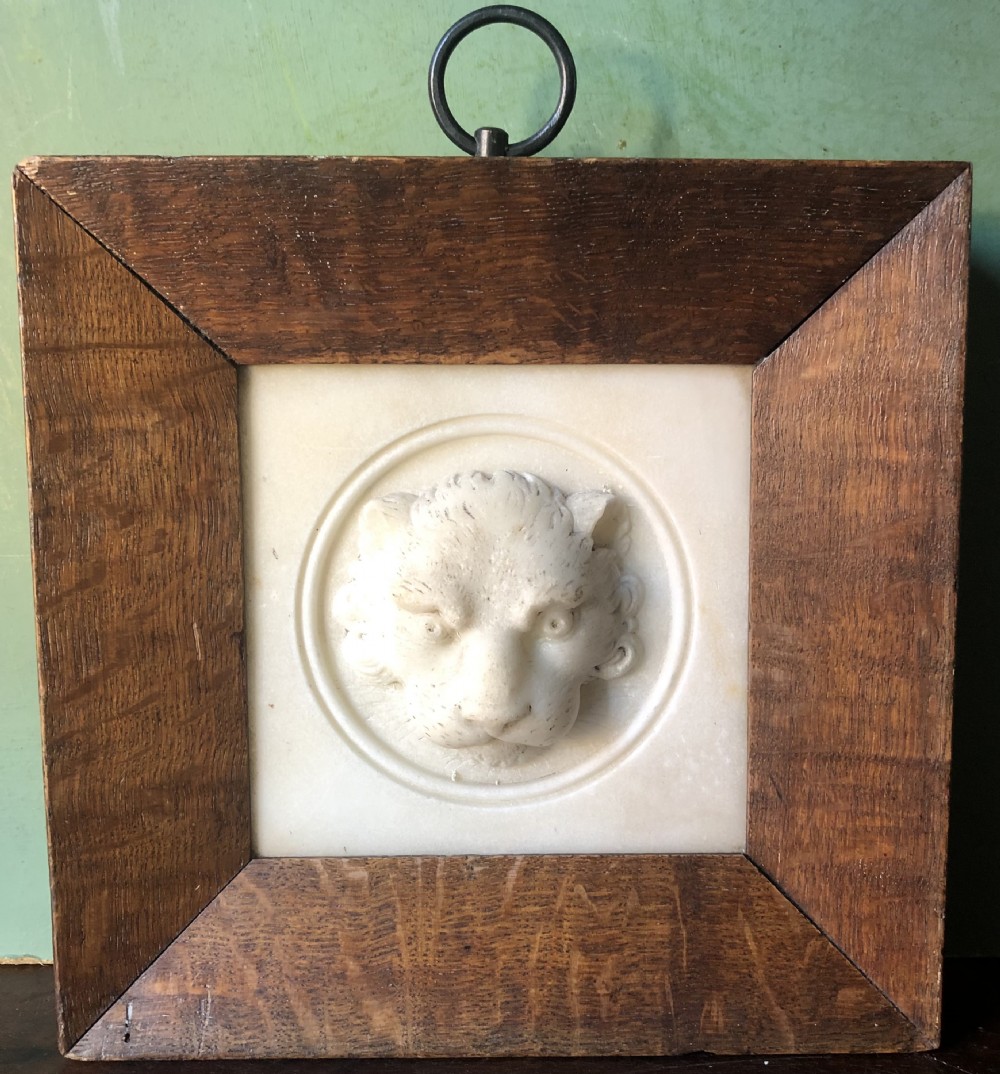 Early C19th Regency period framed carved statuary marble study of a lion’s mask.