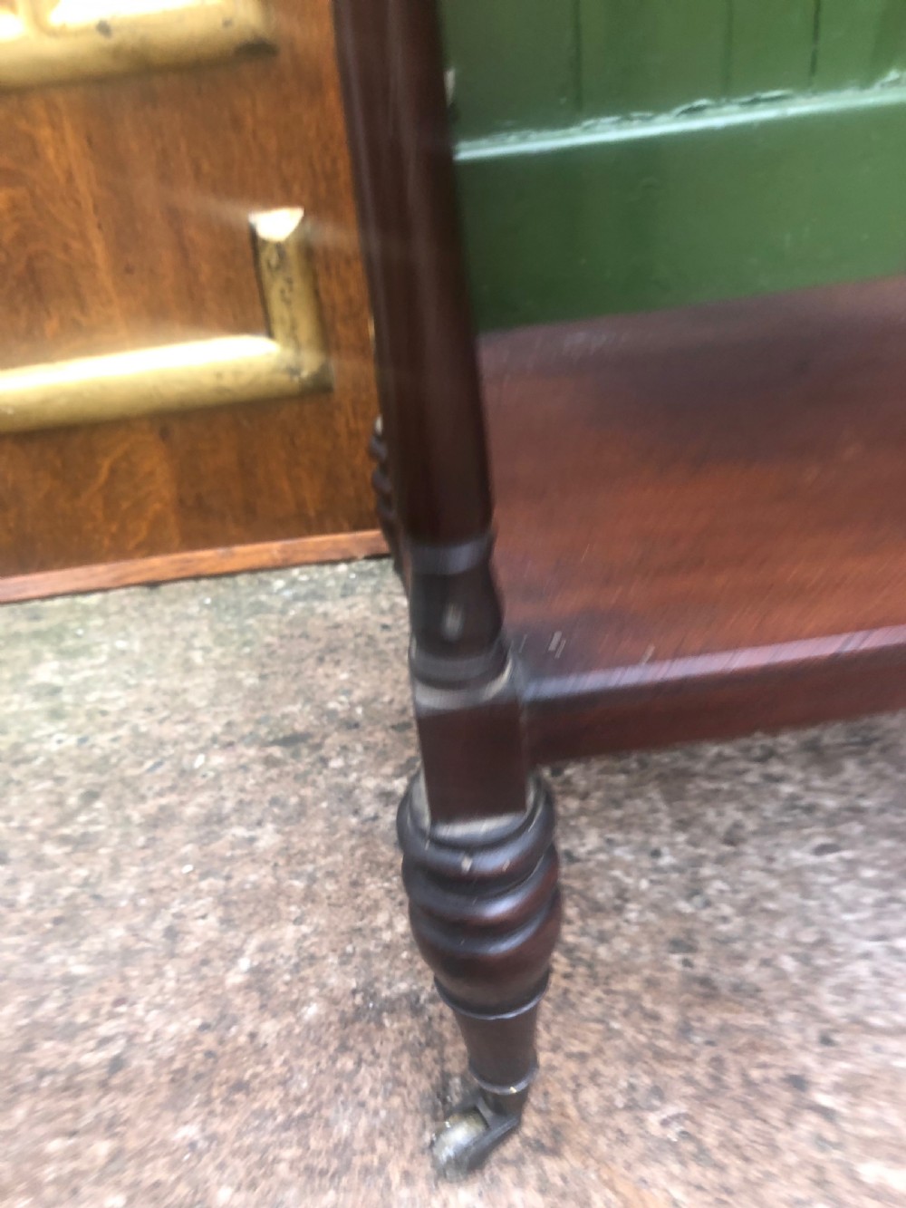 An early 19th-century George III mahogany three-tiered etagere with turned upright supports and brass castors. View VI