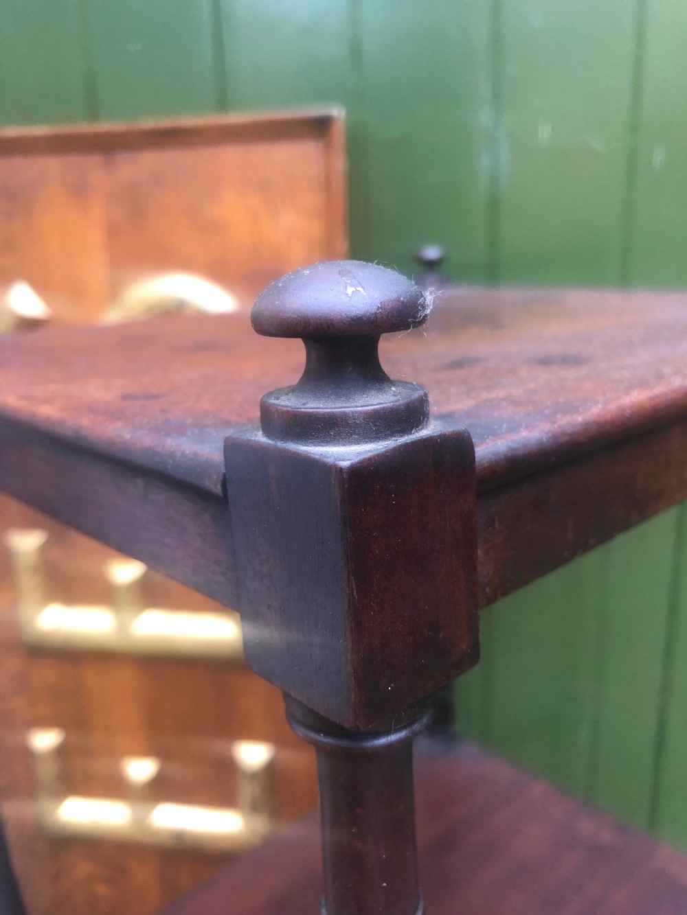 An early 19th-century George III mahogany three-tiered etagere with turned upright supports and brass castors. View VIII