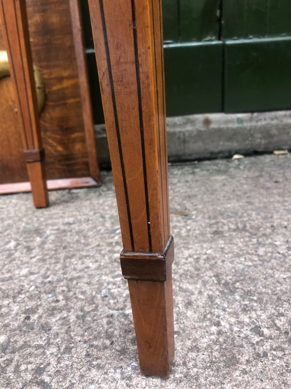 A late 18th-century George III satinwood fold-over card table featuring rosewood crossbanding, line inlay, and tapered square legs. View V