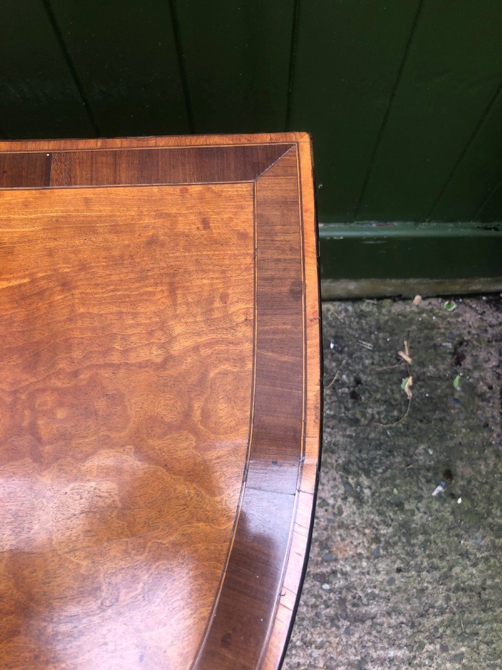 A late 18th-century George III satinwood fold-over card table featuring rosewood crossbanding, line inlay, and tapered square legs. View VI