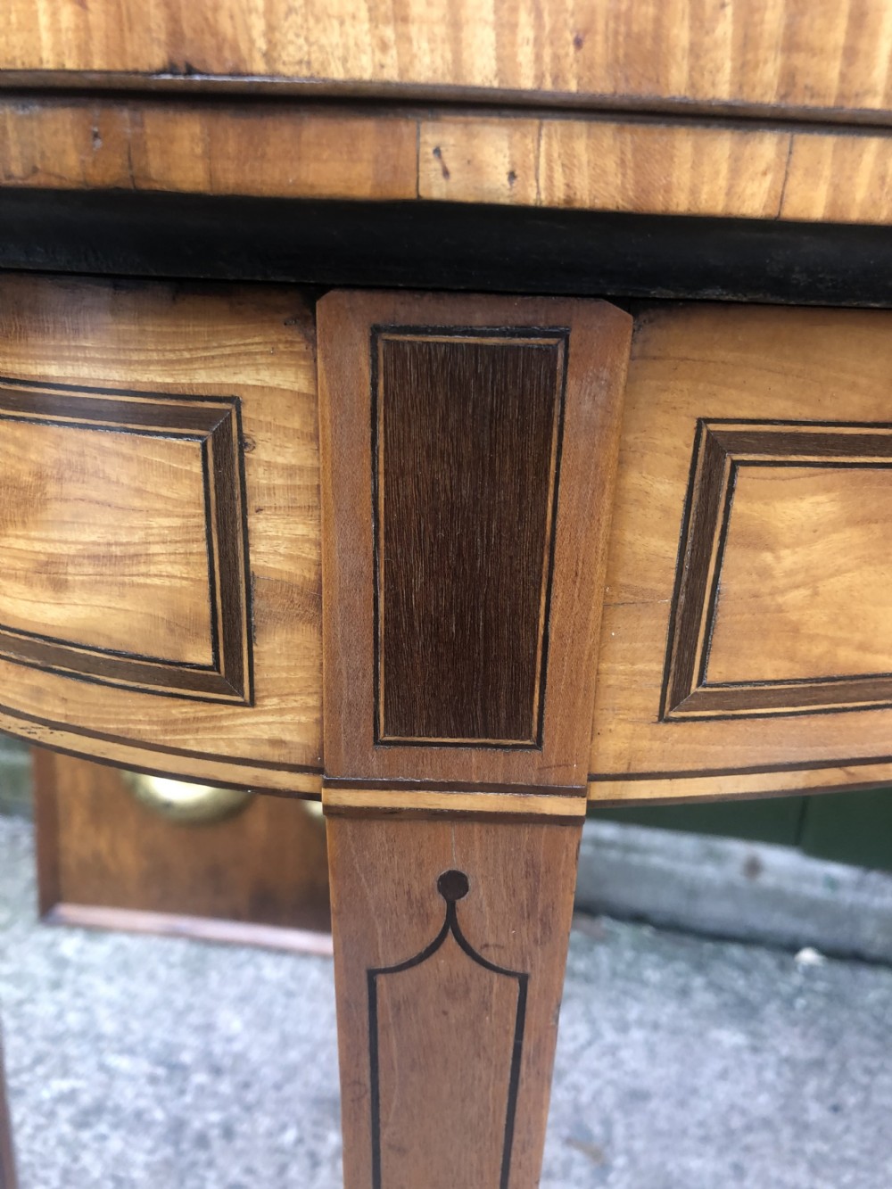 A late 18th-century George III satinwood fold-over card table featuring rosewood crossbanding, line inlay, and tapered square legs. View XIII
