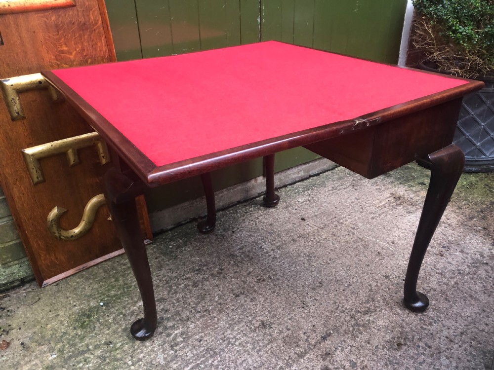 A mid-18th-century George II mahogany fold-over gaming table featuring elegant cabriole legs with pad feet. View VII