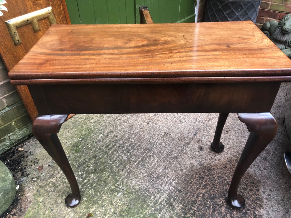 A mid-18th-century George II mahogany fold-over gaming table featuring elegant cabriole legs with pad feet. View VIII