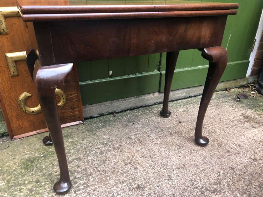 A mid-18th-century George II mahogany fold-over gaming table featuring elegant cabriole legs with pad feet. View IX