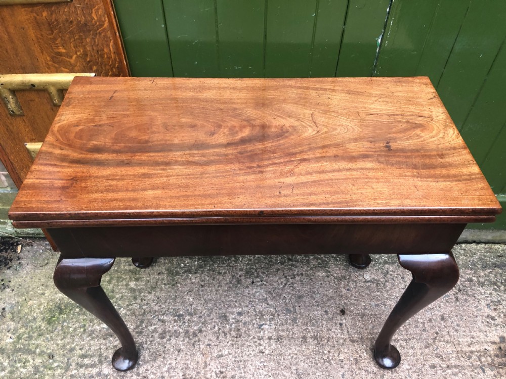 A mid-18th-century George II mahogany fold-over gaming table featuring elegant cabriole legs with pad feet. View XII