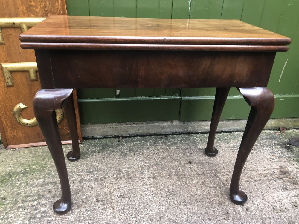 A mid-18th-century George II mahogany fold-over gaming table featuring elegant cabriole legs with pad feet. View XIX