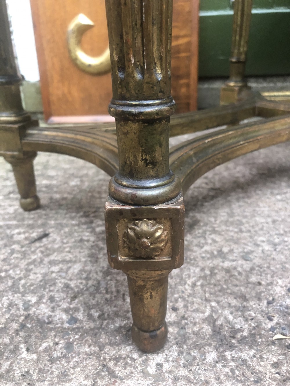 An early 20th-century French Louis XVI style low table with a green marble top, giltwood frame, fluted legs, and carved rosette details. View XIII