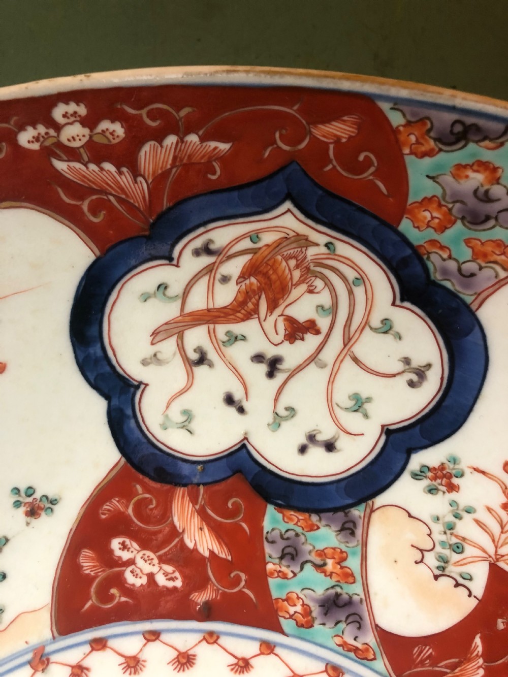 Mid C19th Japanese porcelain dished charger decorated in the Imari palette. View VI