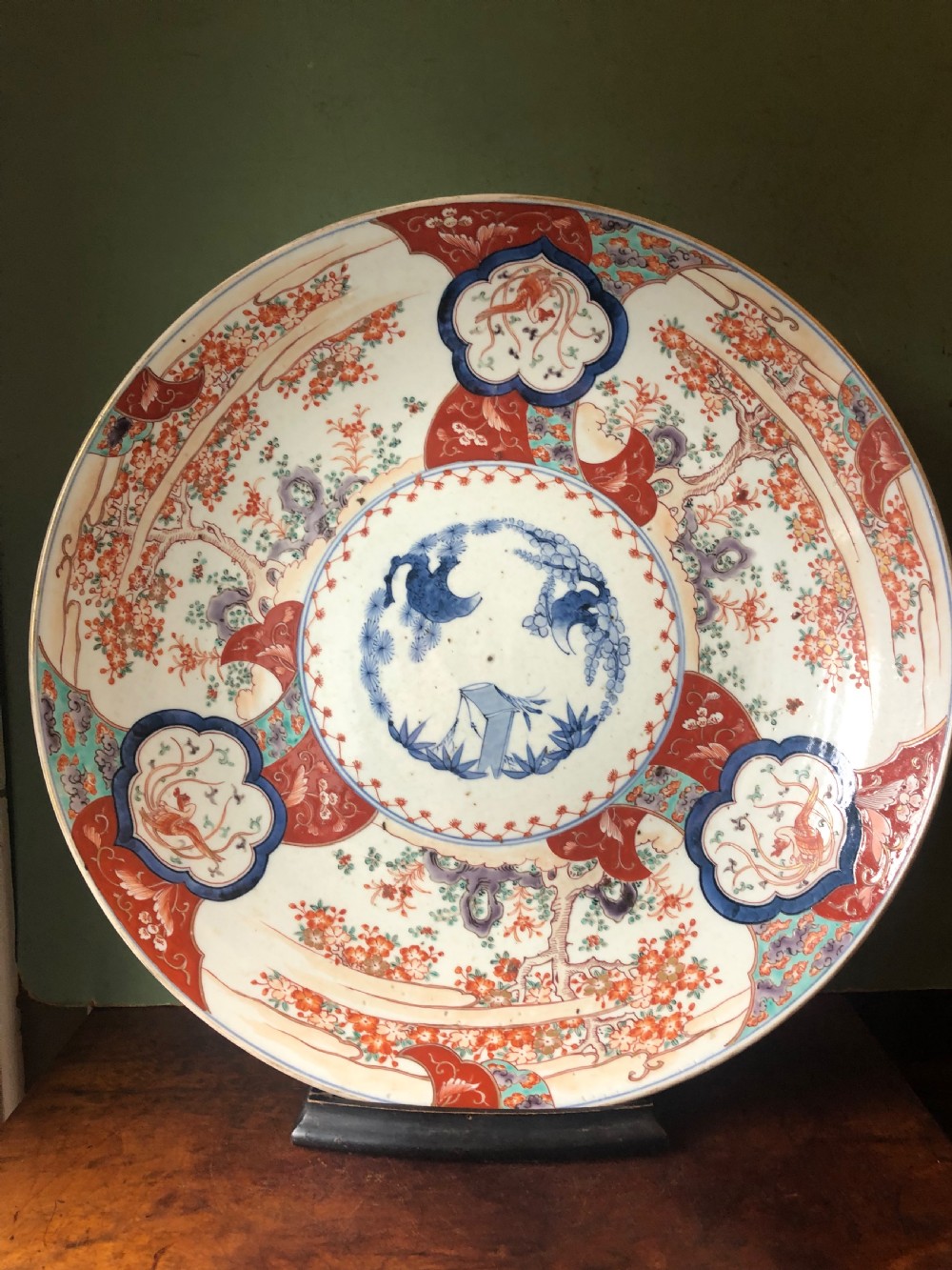 Mid C19th Japanese porcelain dished charger decorated in the Imari palette. View VIII
