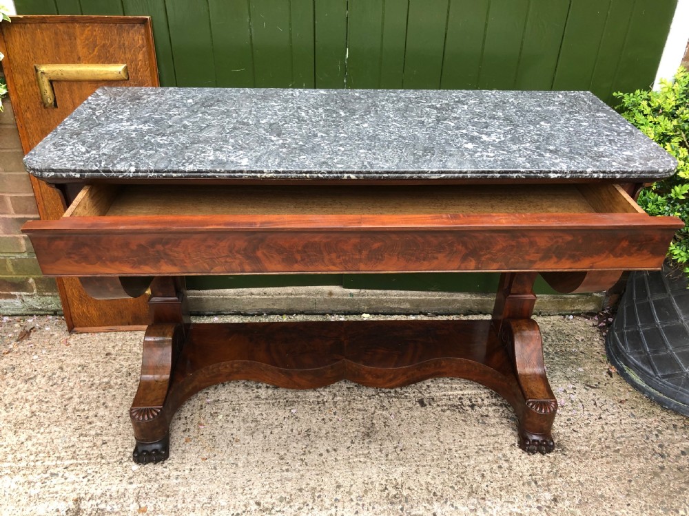 Early C19th French Charles X Restauration period mahogany console table fitted with original marble top . View V