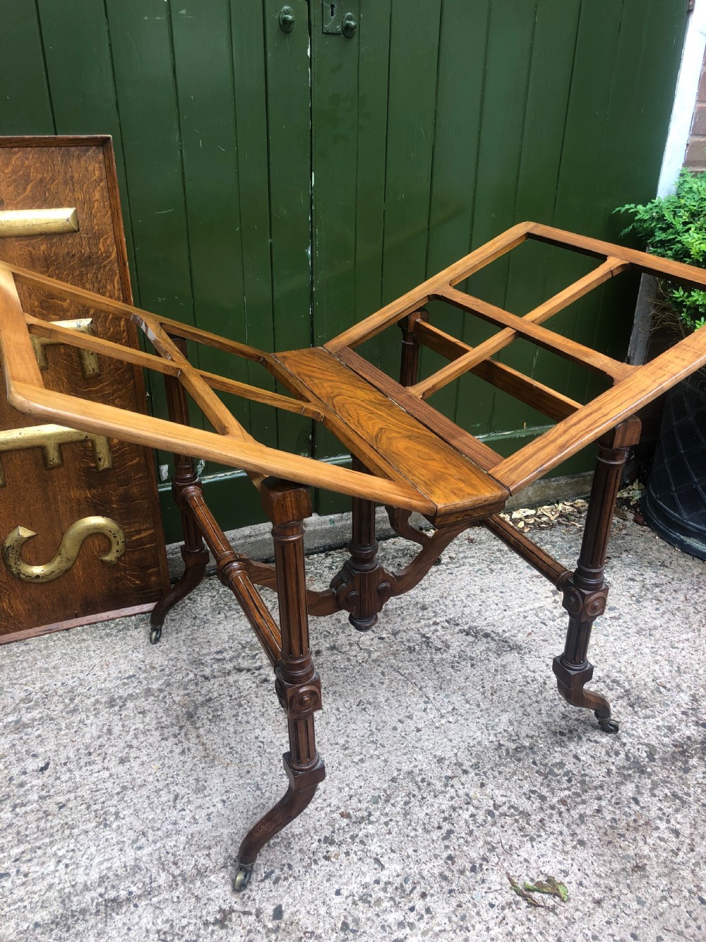 Mid C19th walnut-framed library or gallery folio-stand with an unusual folding action . View III