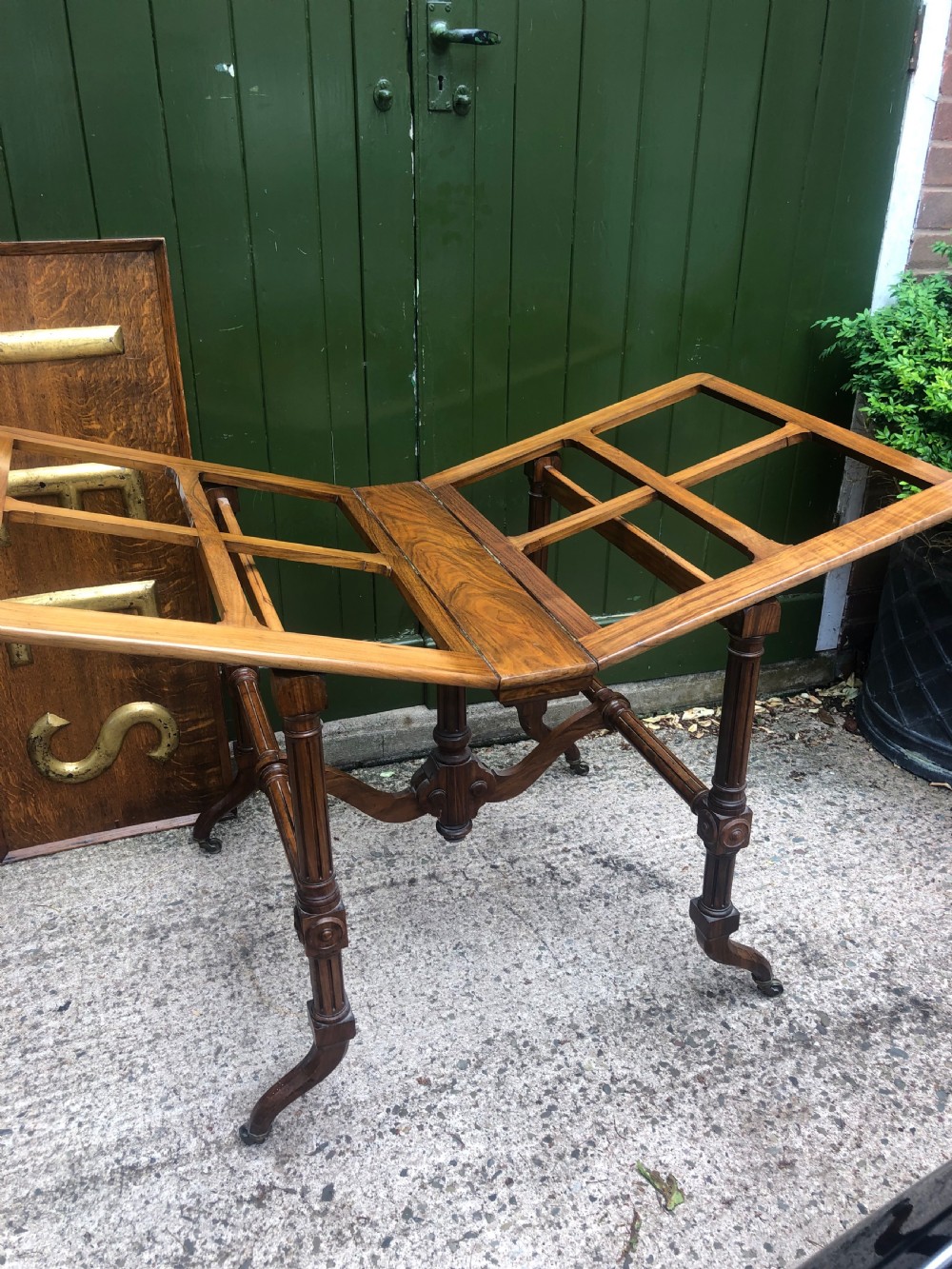 Mid C19th walnut-framed library or gallery folio-stand with an unusual folding action . View IV