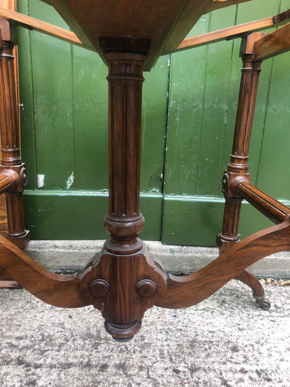 Mid C19th walnut-framed library or gallery folio-stand with an unusual folding action . View V