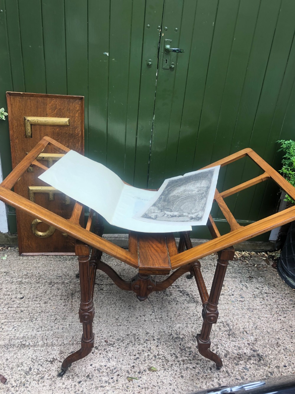 Mid C19th walnut-framed library or gallery folio-stand with an unusual folding action . View X