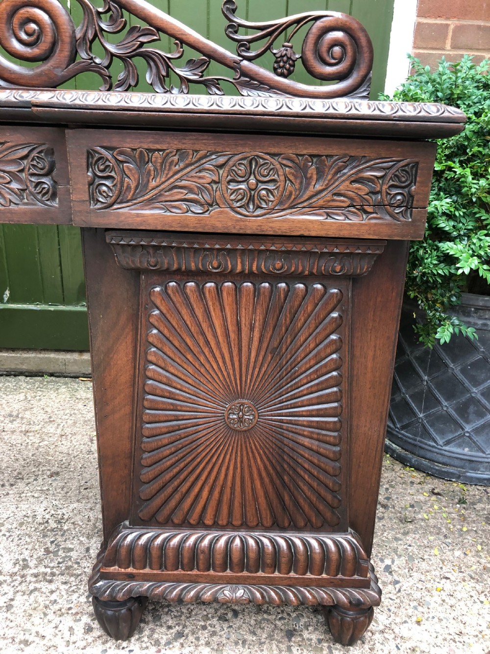 C19th Anglo-Indian carved padauk pedestal sideboard. View IV