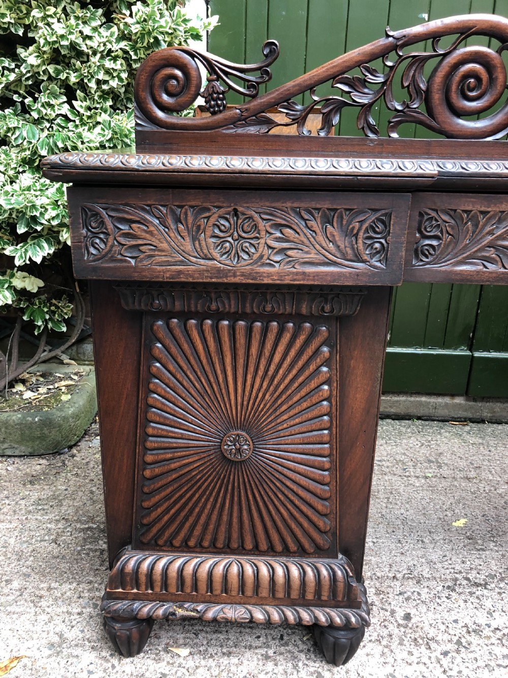 C19th Anglo-Indian carved padauk pedestal sideboard. View VI