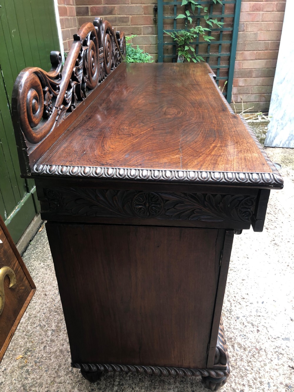 C19th Anglo-Indian carved padauk pedestal sideboard. View VII