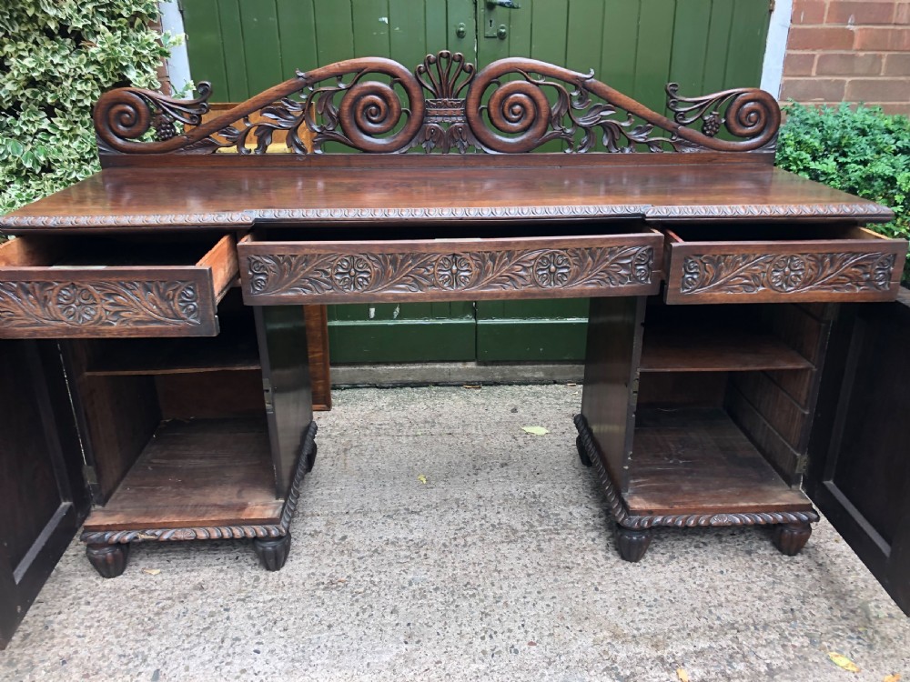 C19th Anglo-Indian carved padauk pedestal sideboard. View VIII