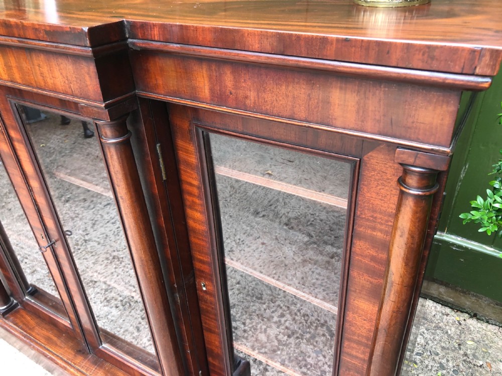 Early C19th Regency period mahogany 4-door ‘dwarf’ bookcase cabinet of breakfront outline. View X
