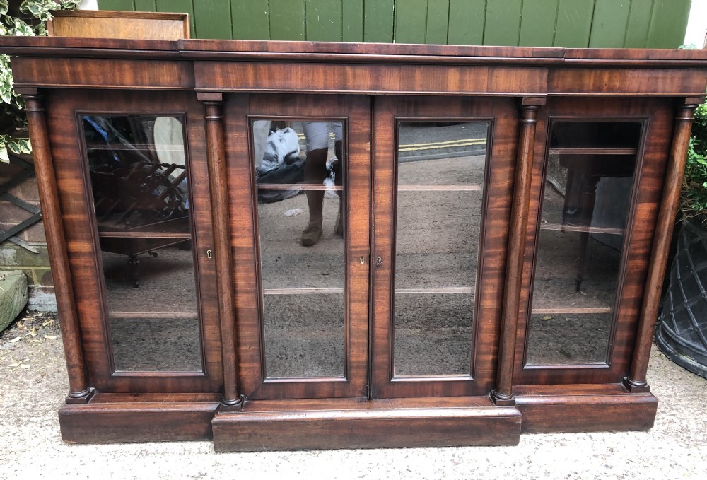 Early C19th Regency period mahogany 4-door ‘dwarf’ bookcase cabinet of breakfront outline.