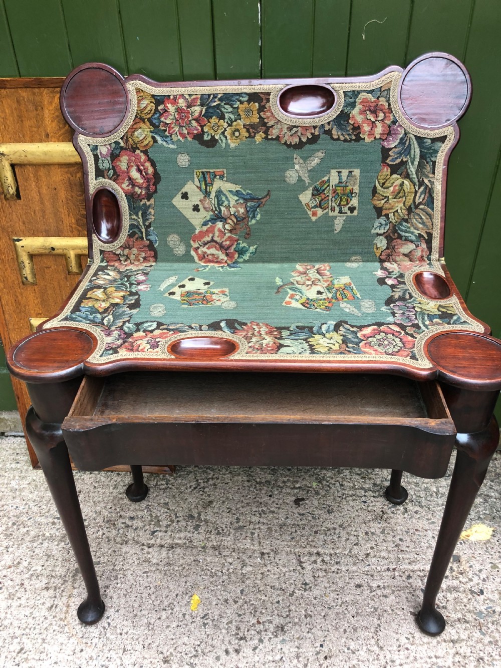 A mid-18th-century George II mahogany fold-over card table featuring slender cabriole legs terminating in pad feet and a shaped top. View IV