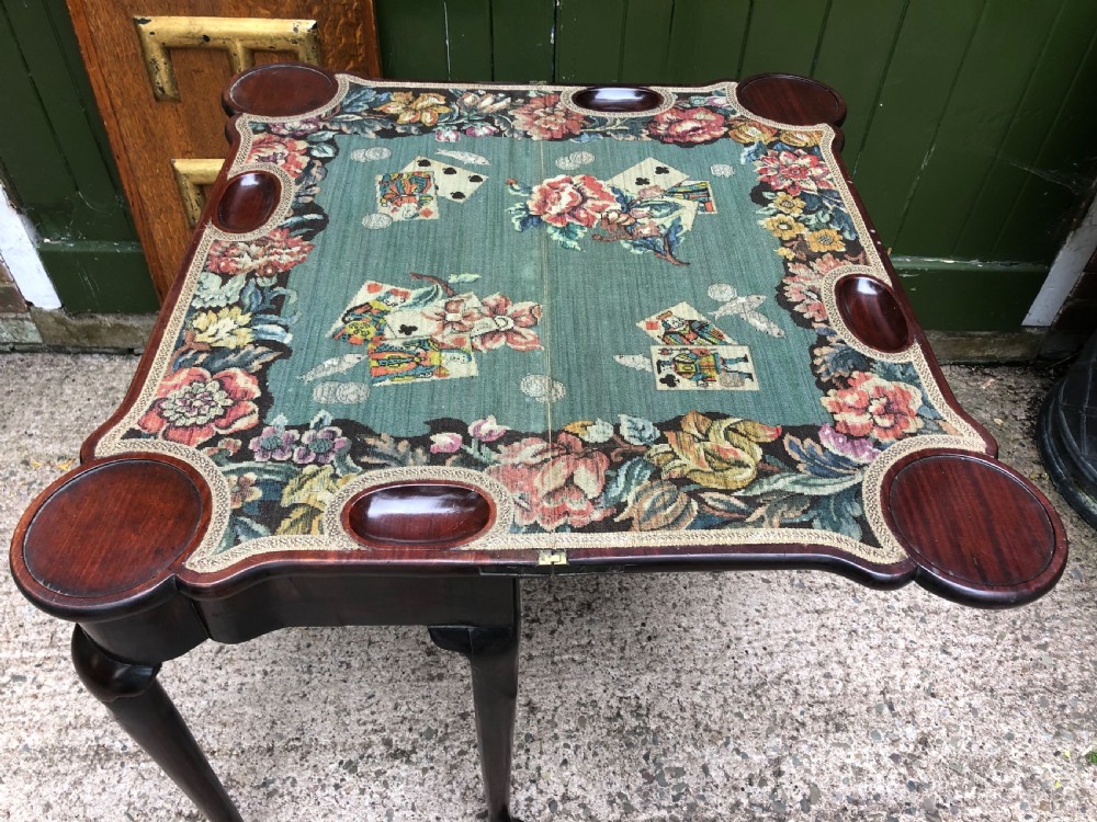 A mid-18th-century George II mahogany fold-over card table featuring slender cabriole legs terminating in pad feet and a shaped top. View VI