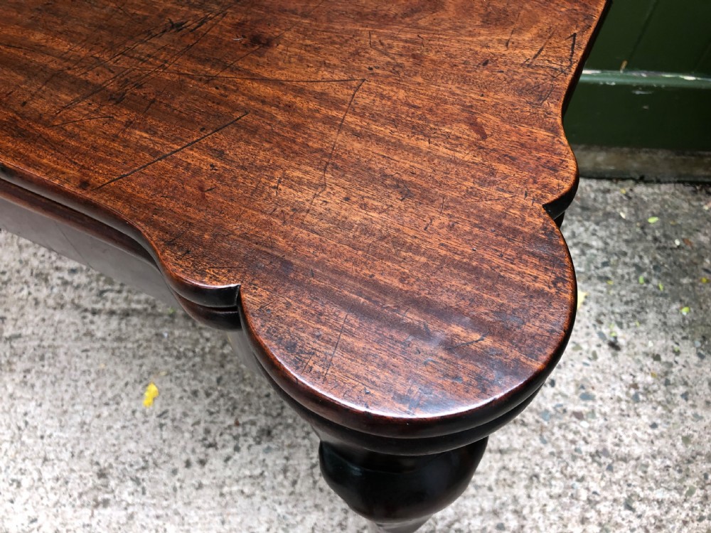 A mid-18th-century George II mahogany fold-over card table featuring slender cabriole legs terminating in pad feet and a shaped top. View XI