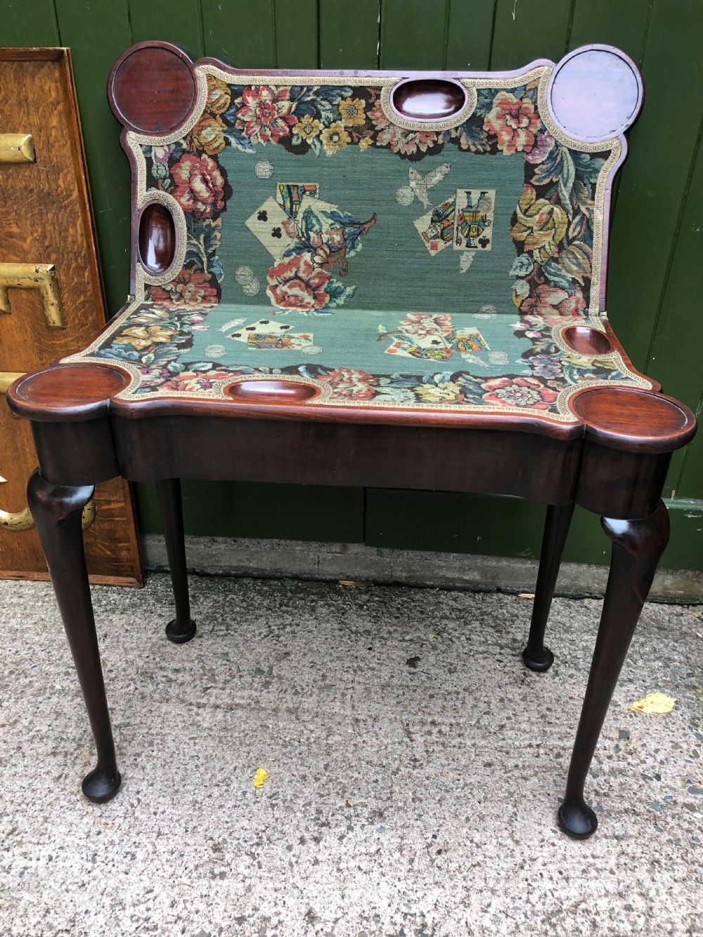 A mid-18th-century George II mahogany fold-over card table featuring slender cabriole legs terminating in pad feet and a shaped top. View XIII