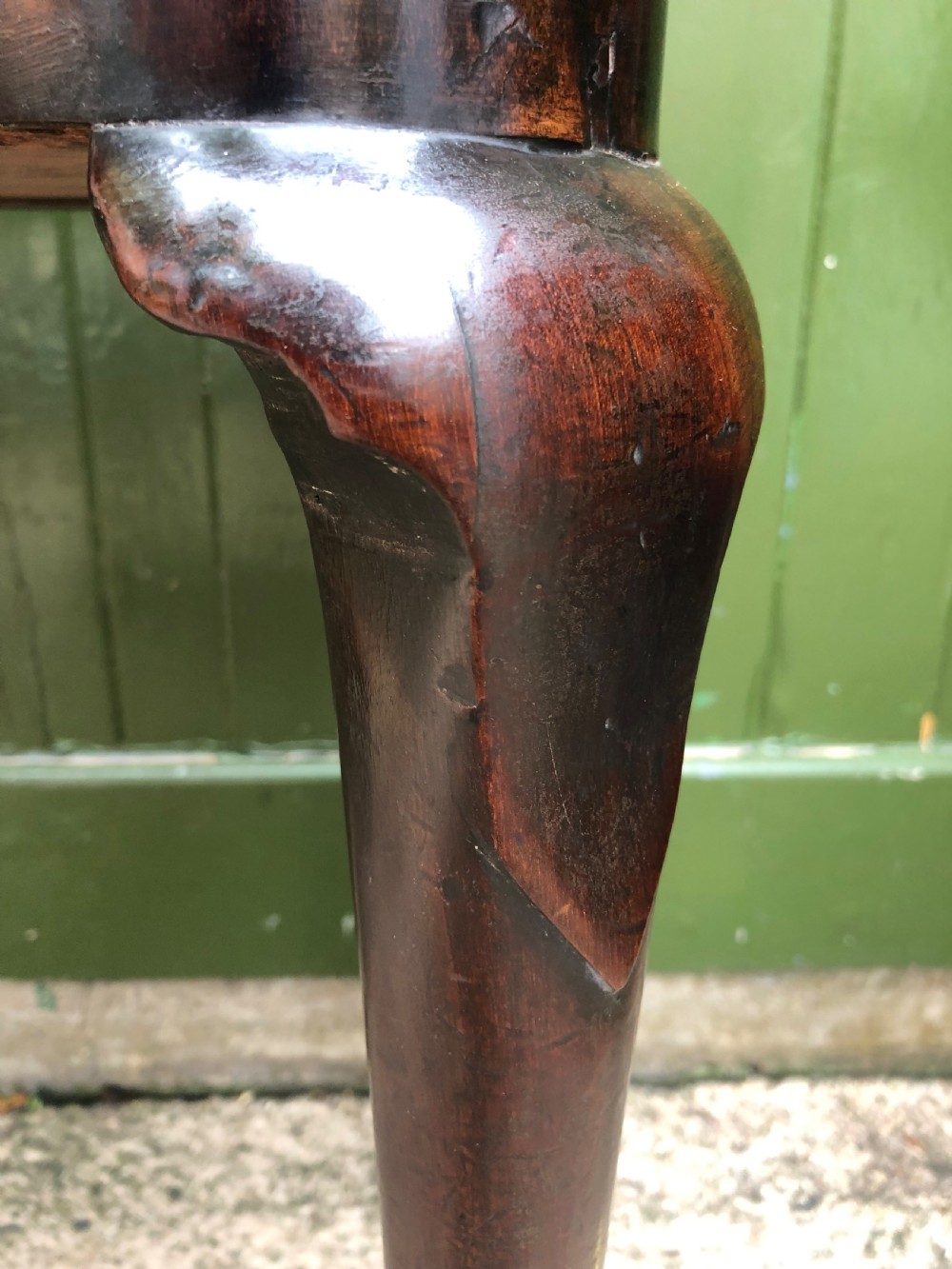 A mid-18th-century George II mahogany fold-over card table featuring slender cabriole legs terminating in pad feet and a shaped top. View XVI