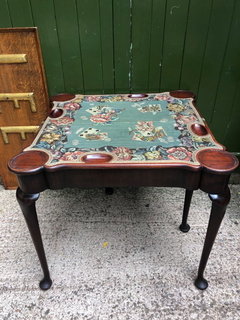 A mid-18th-century George II mahogany fold-over card table featuring slender cabriole legs terminating in pad feet and a shaped top. View XIX