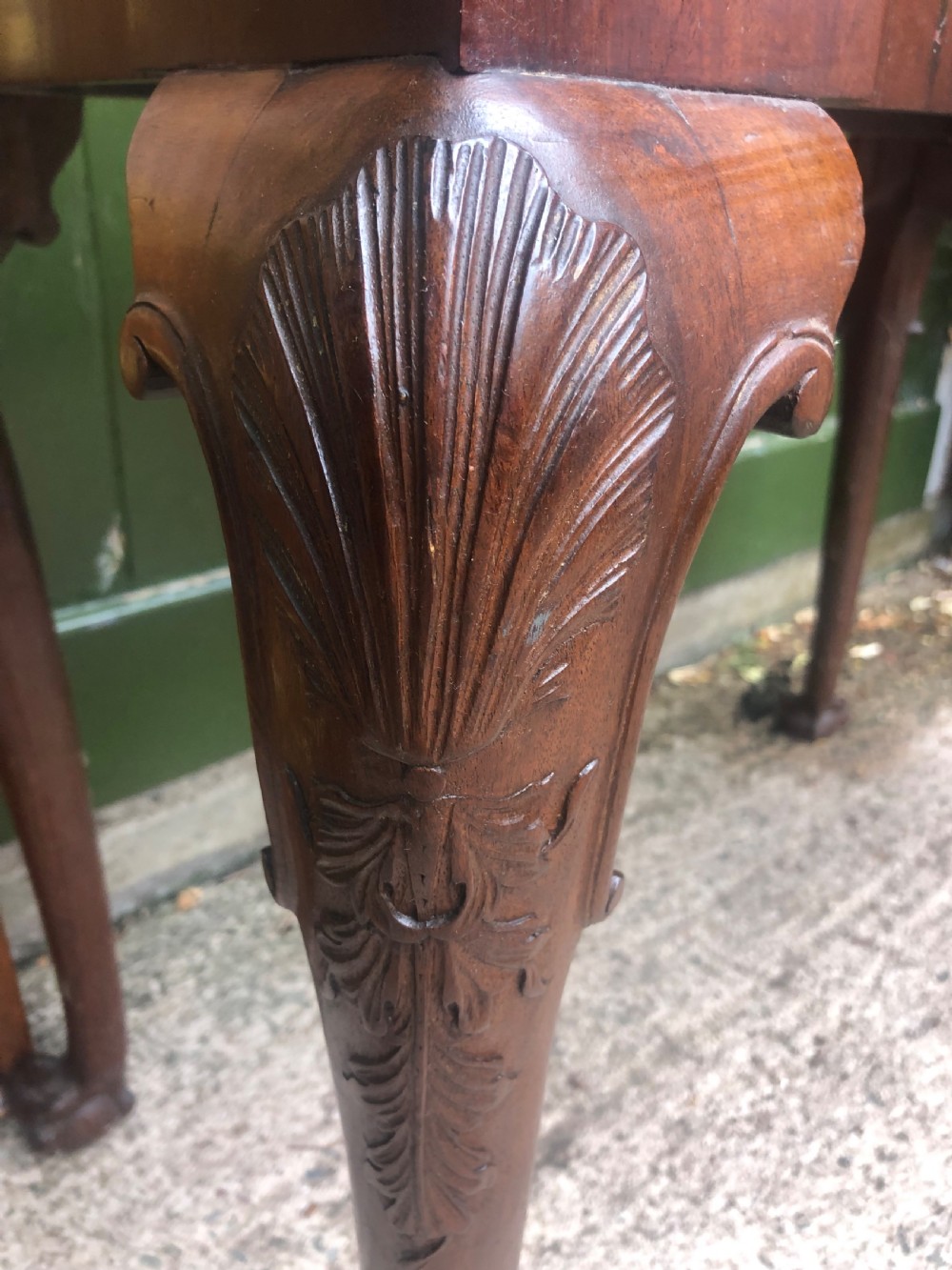 A mid-18th-century George II mahogany fold-over card table featuring carved cabriole legs and claw and ball feet. View III