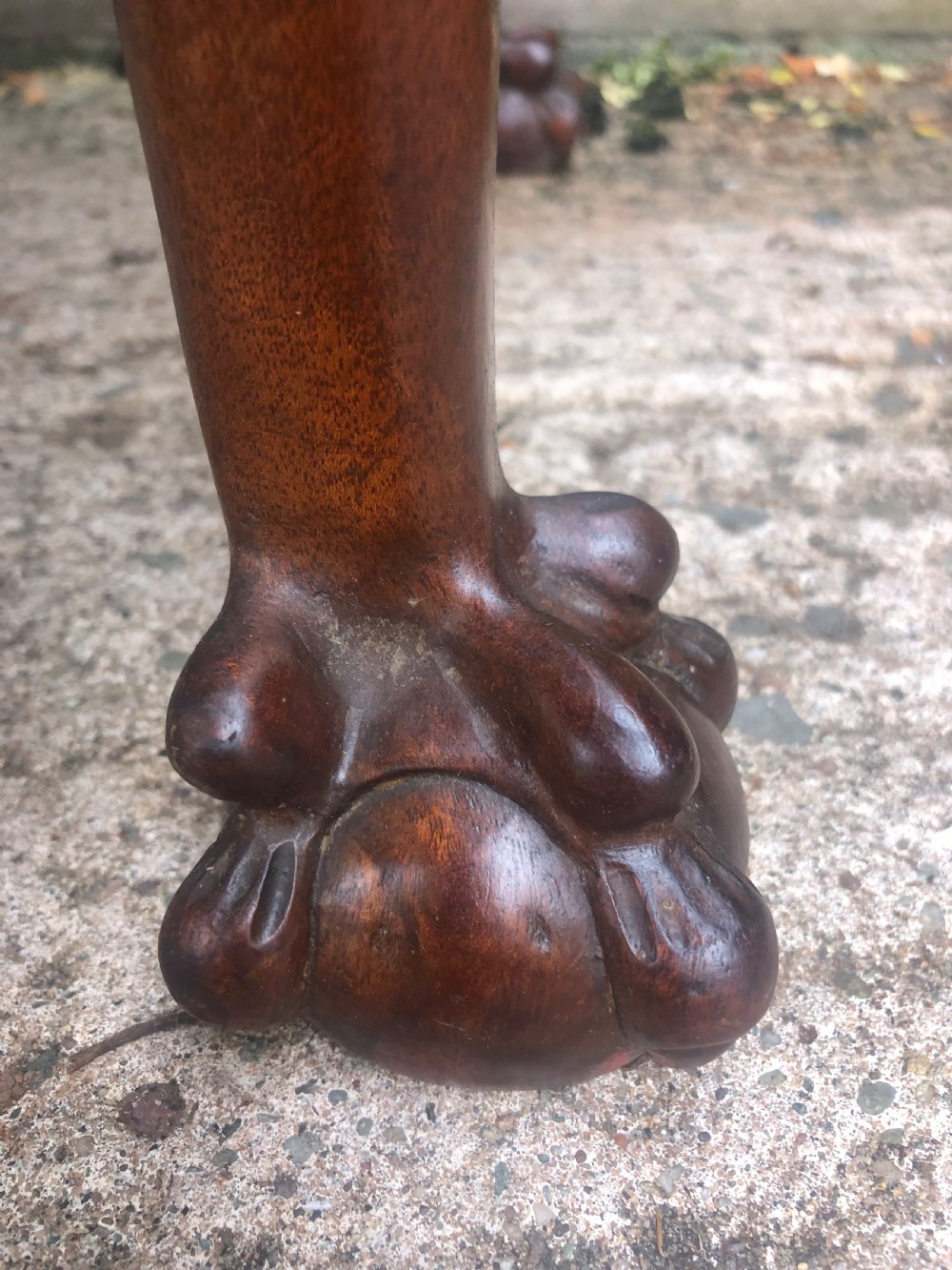 A mid-18th-century George II mahogany fold-over card table featuring carved cabriole legs and claw and ball feet. View V