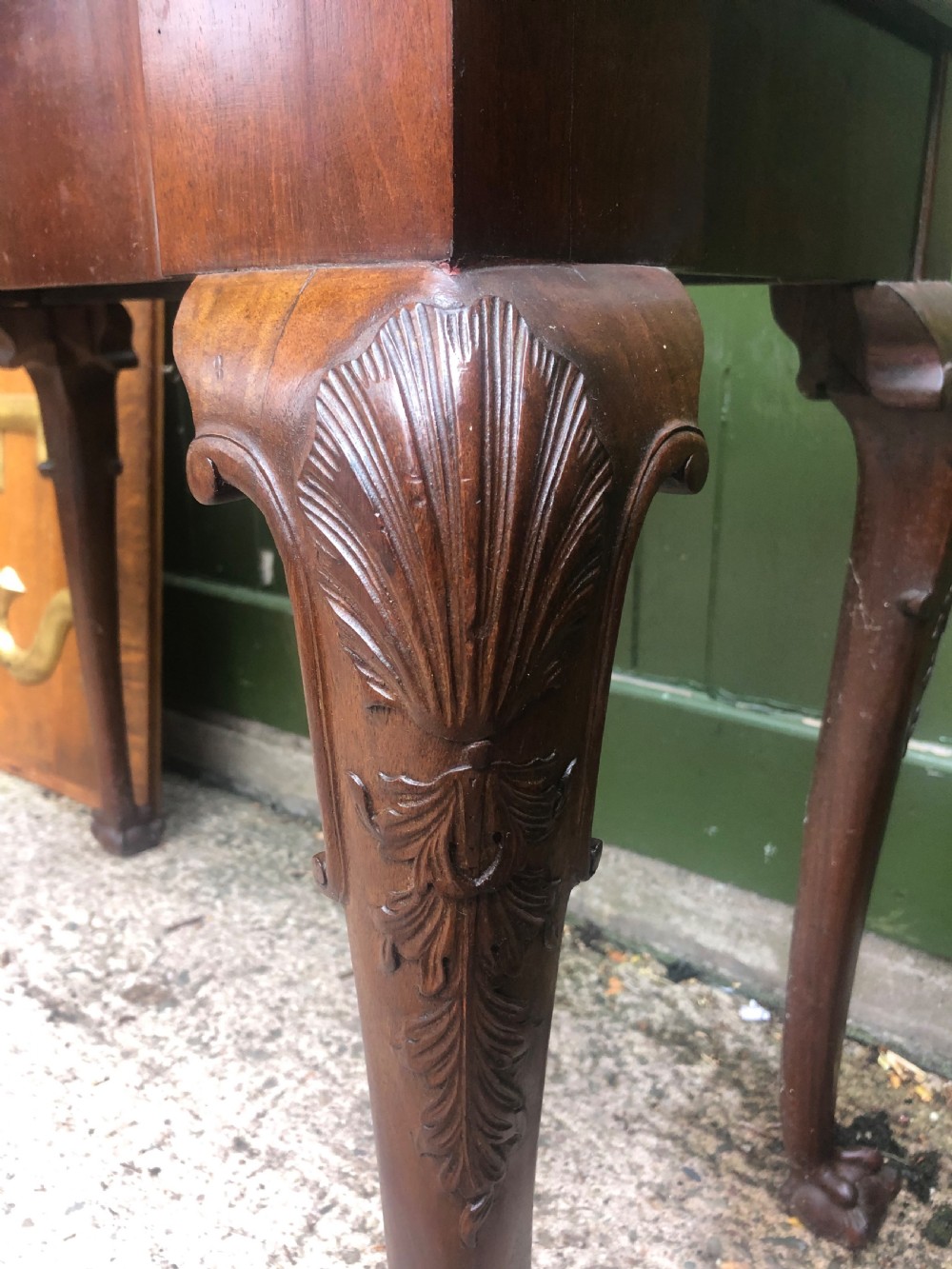 A mid-18th-century George II mahogany fold-over card table featuring carved cabriole legs and claw and ball feet. View VI