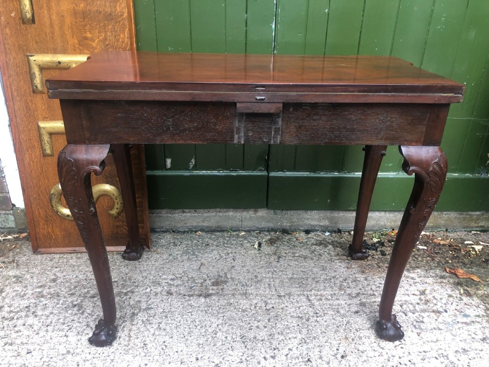 A mid-18th-century George II mahogany fold-over card table featuring carved cabriole legs and claw and ball feet. View XIII