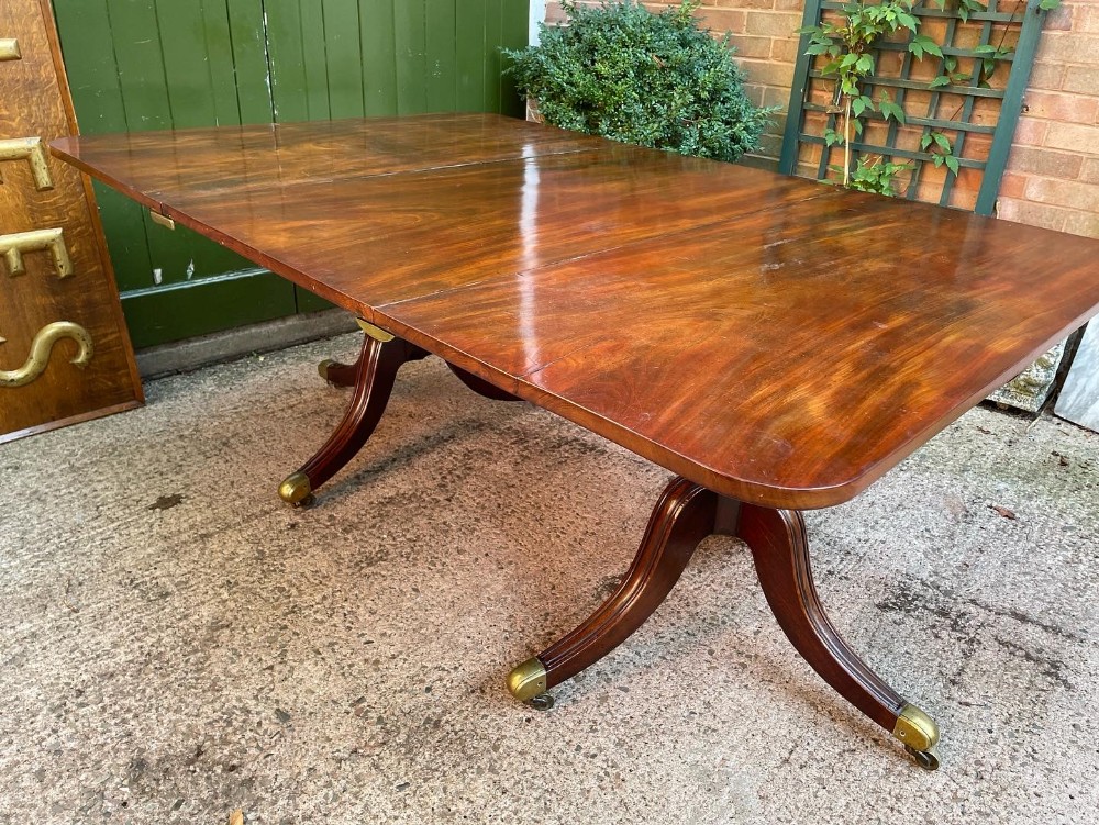 Early C19th Regency period mahogany twin-pillar dining table .