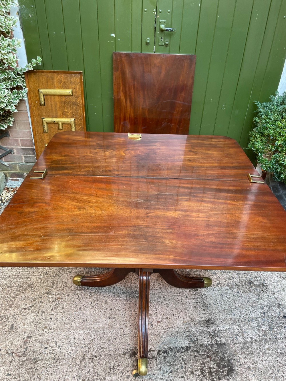 Early C19th Regency period mahogany twin-pillar dining table . View VII