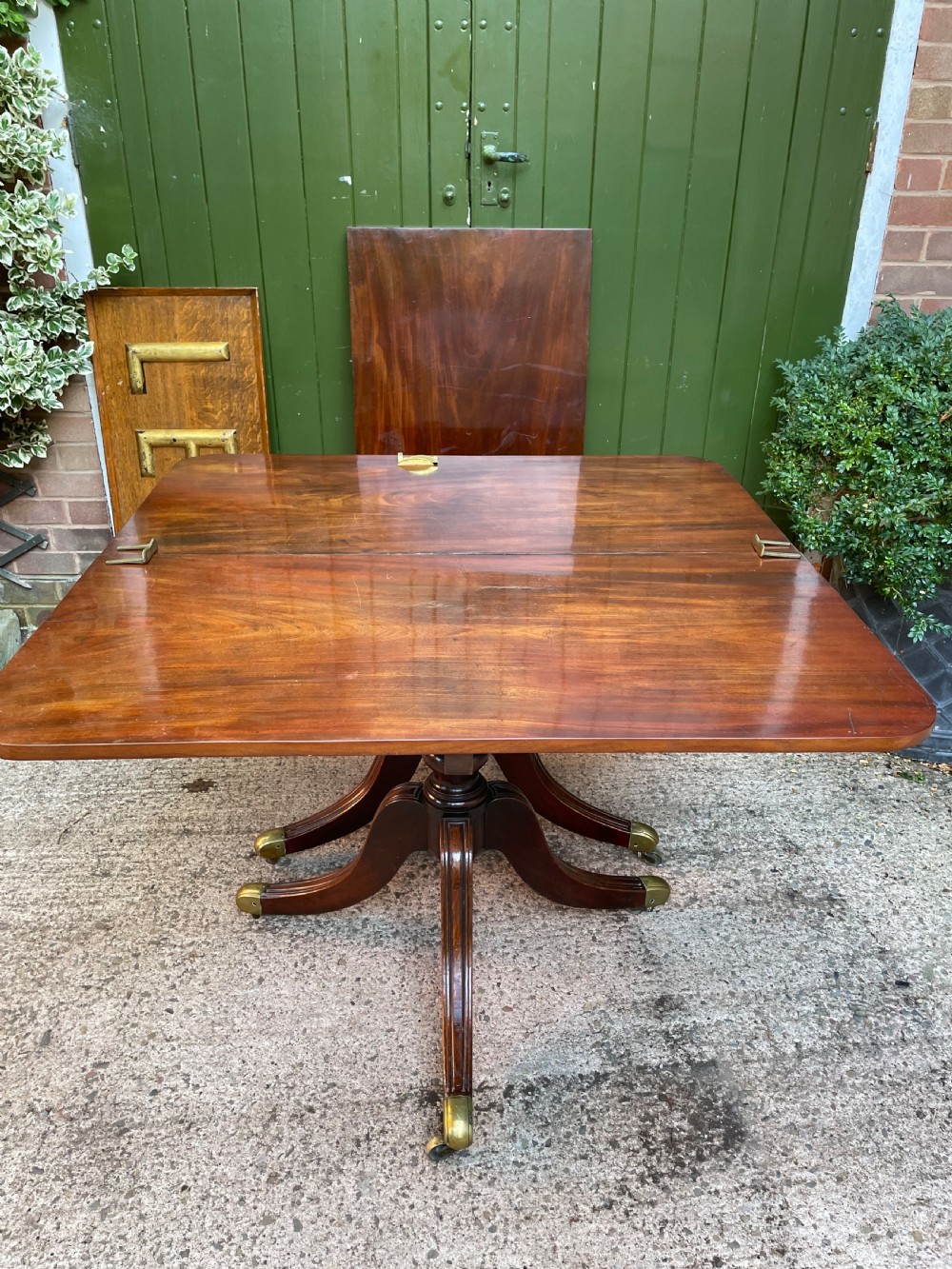 Early C19th Regency period mahogany twin-pillar dining table . View VIII