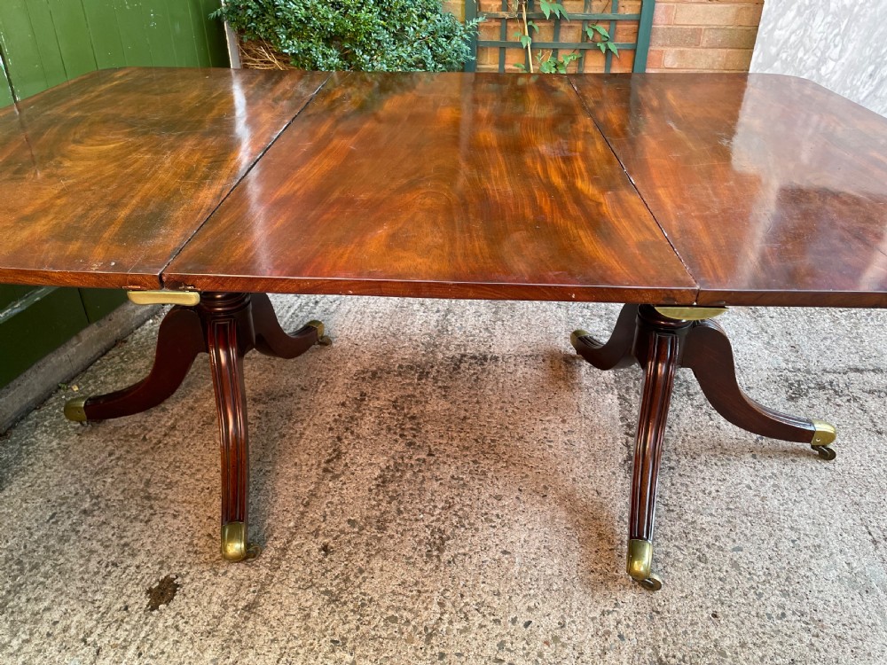 Early C19th Regency period mahogany twin-pillar dining table . View XI