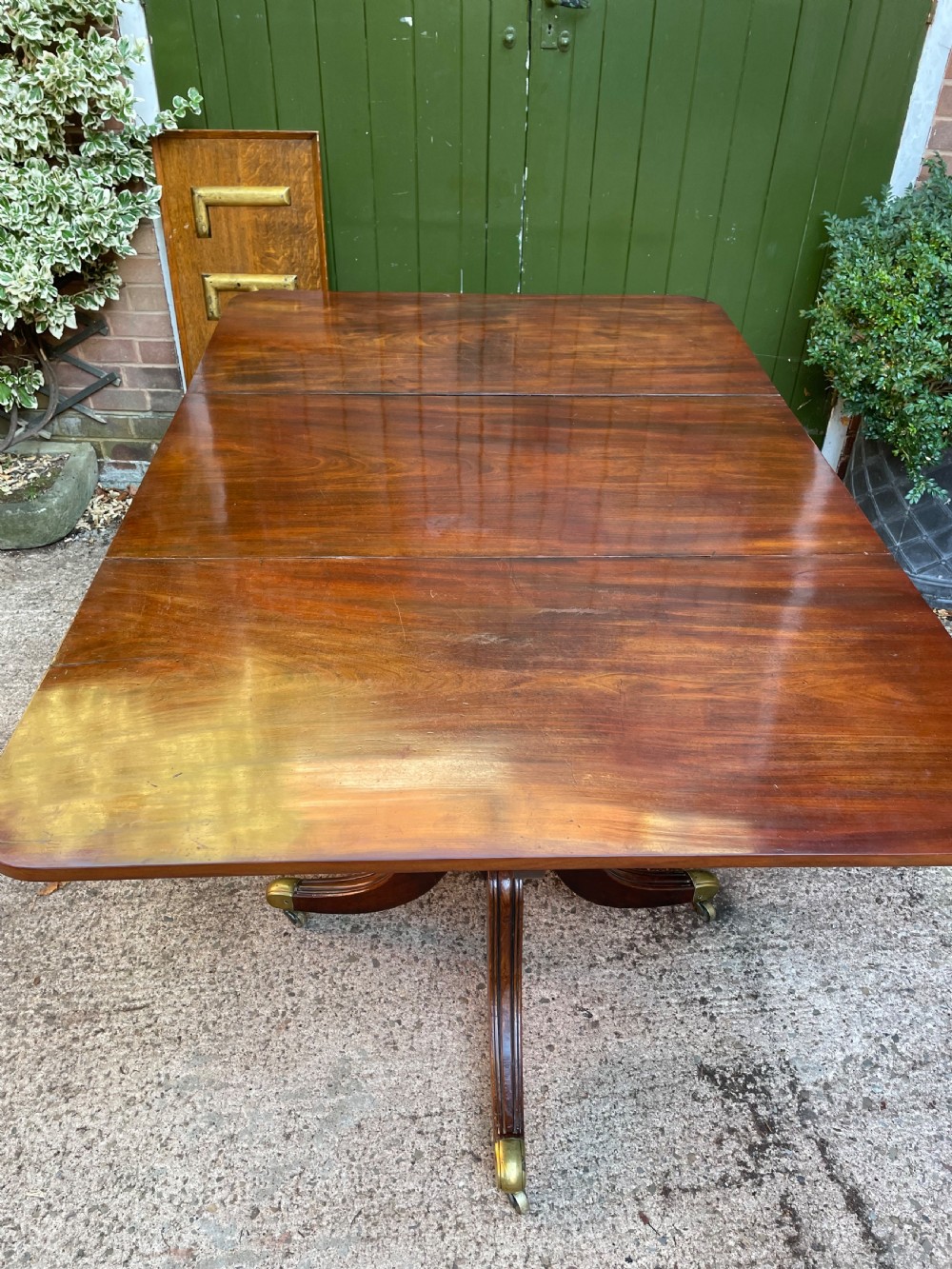 Early C19th Regency period mahogany twin-pillar dining table . View XII