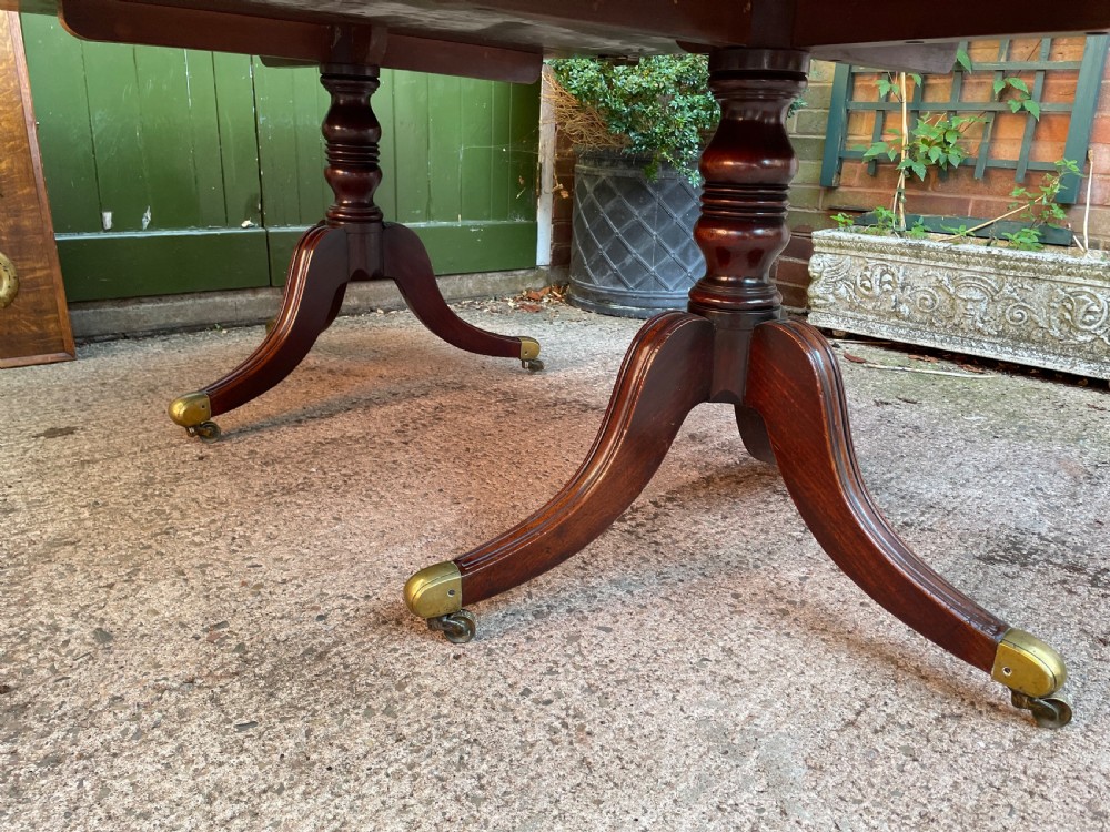 Early C19th Regency period mahogany twin-pillar dining table . View XIV